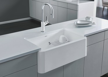 White Silgranit farmhouse style sink in a modern kitchen